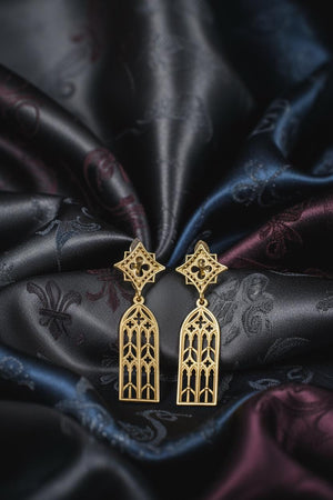 The window earrings are reimagined in 14k Yellow Gold. The transformation turns the "stone" tracery into "sunlit" frames. The gold warms the sharp lines, making them look like reliquaries or gilded gates. This version feels luxurious and holy, perfect for a wearer who wants to carry the warmth of a candlelit cathedral with them. (etsy image id: 7218591690)