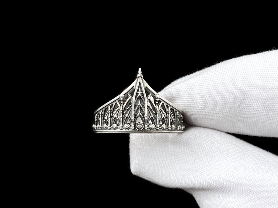 The spire represents the connection between the earth and the heavens, or high aspirations. The ribbed vaulting represents strength through structure. Wearing this ring as a "crown" on the finger symbolizes personal sovereignty and a dedication to higher ideals. It is a piece that commands respect. (etsy image id: 7976017075)