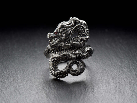 Looking for a bold and stylish accessory to add to your collection? Check out this stunning Sterling Silver Ring featuring a Chinese Dragon design.