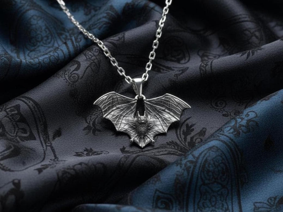 Featuring a detailed bat with outstretched wings, our unique design is sure to stand out. Don't let the darkness keep you down—power up your style with a silver bat pendant today! (etsy image id: 6086867201)