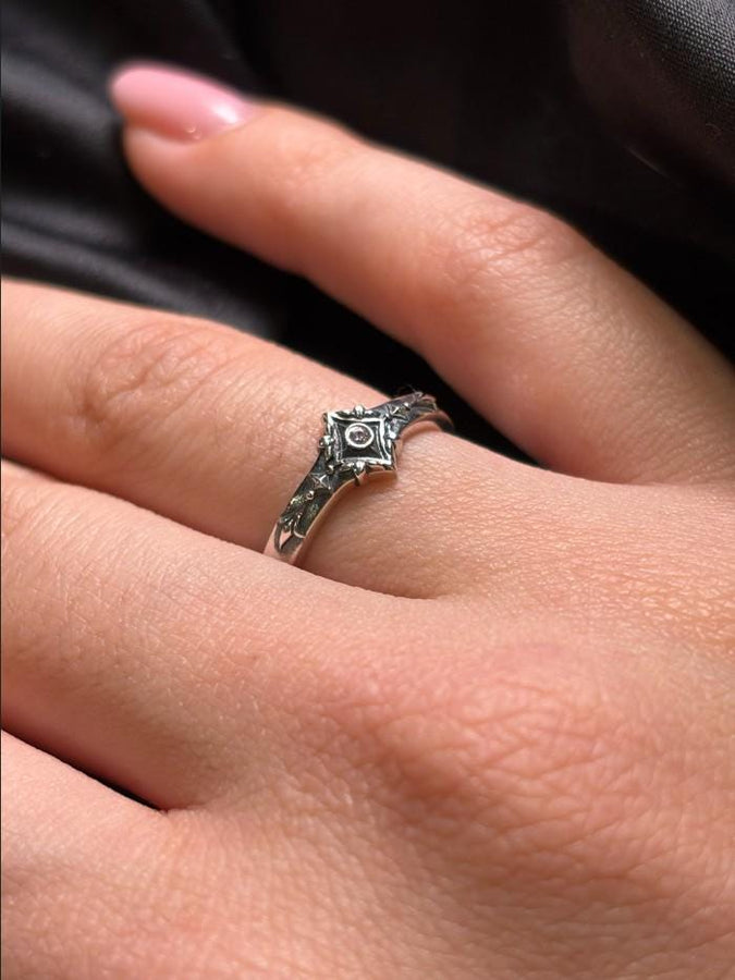 Featuring intricate gothic motifs and a mesmerizing gemstone, this silver ring is a one-of-a-kind piece that will captivate anyone with an eye for unique, elegant jewelry. (etsy image id: 7375563764)