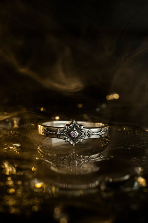 Featuring intricate gothic motifs and a mesmerizing gemstone, this silver ring is a one-of-a-kind piece that will captivate anyone with an eye for unique, elegant jewelry. (etsy image id: 7375563764)
