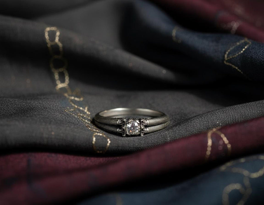 A handcrafted sterling silver ring inspired by ancient Greek architecture, featuring vertical column grooves and a raised stone bezel. The Art Deco influence enhances the structured design, giving it a refined yet historical appearance. Excellent for proposal moments, themed weddings, or collectors who love architectural motifs in fine jewelry. (etsy image id: 6163725531)