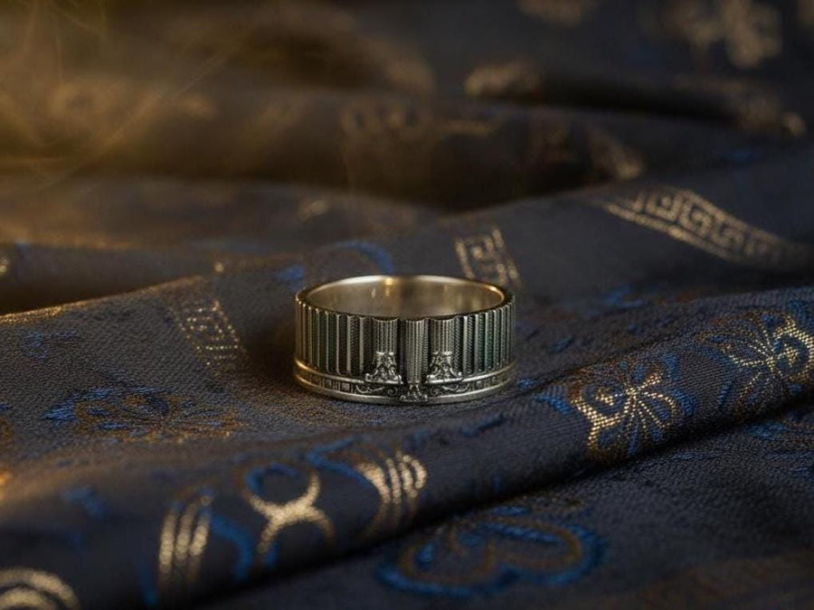A handcrafted silver band ring with an ancient architectural theme. The carved columns and decorative patterns resemble historic Greek structures, giving the jewelry a symbolic and powerful presence. The design suits collectors of classical art, mythology enthusiasts and anyone who values bold and meaningful accessories. (etsy image id: 7417729506)