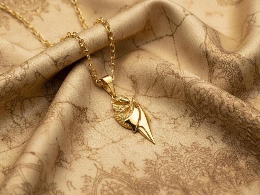 A detailed close-up studio shot of a sterling silver pendant shaped like two flying foxes or fruit bats. The bats are intimately huddled together, wrapped within the smooth, sweeping folds of their leathery wings. The metal is highly textured to show the fine details of their fur and faces. The silver is heavily oxidized in the recesses, creating a striking contrast against the polished highlights of the wings. (etsy image id: 5592925539)