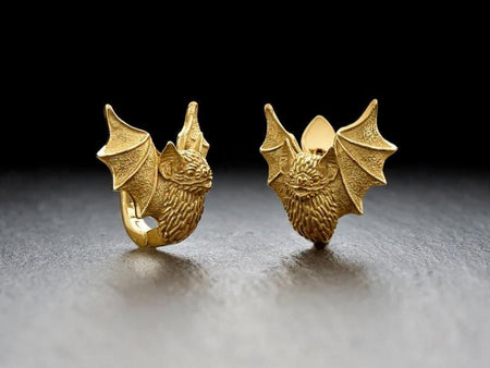 Reimagined in solid 14k yellow gold, these sleeping bat plug earrings transform from creatures of the night into radiant, sunlit treasures. The warm golden metal highlights the intricate fur and wing details, giving the bats an opulent, regal glow. The deep recesses feature a soft matte finish rather than black oxidation, creating a luxurious contrast. This magnificent fine jewelry version elevates the gothic motif into a deeply symbolic masterpi (etsy image id: 7421579043)