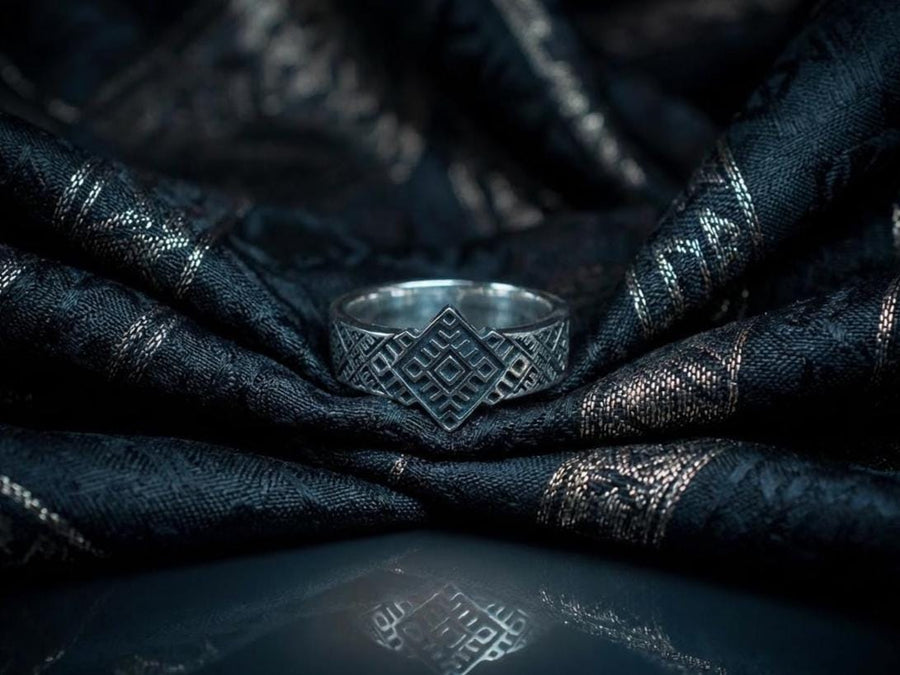 This close-up demonstrates the "relief" texture of the ring. The pattern is not merely etched but deeply cast, with significant height difference between the silver lines and the black background. The 925 sterling silver is substantial and thick. The oxidation is uniform and matte, designed to withstand daily wear without fading, creating a permanent "shadow" that defines the intricate geometry. (etsy image id: 7206997519)