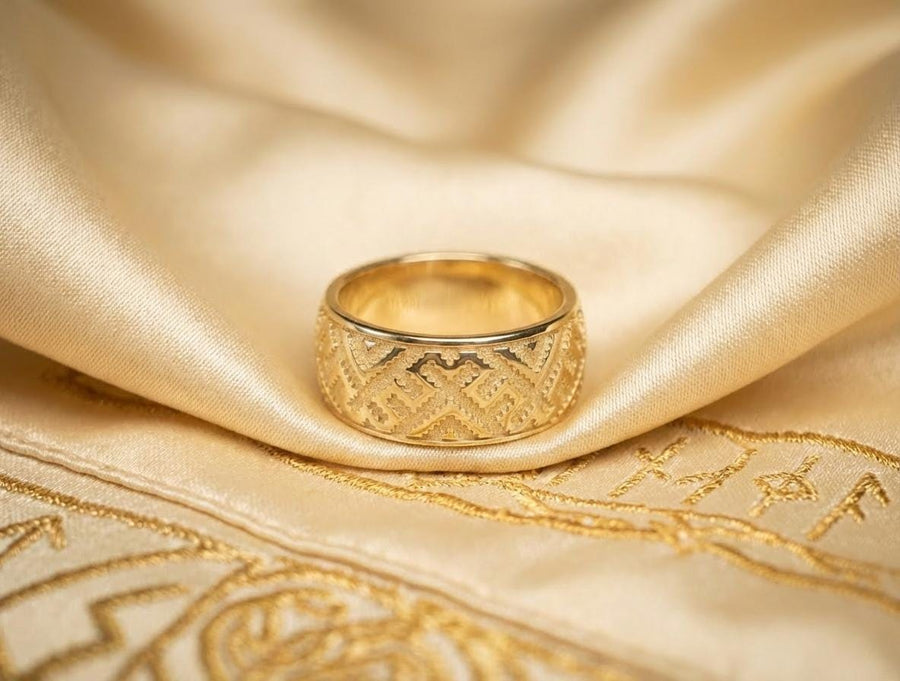 A detailed profile shot of a wide sterling silver ring featuring a repeating "step" or "zig-zag" pattern. The design wraps seamlessly around the entire band. The raised geometric lines are highly polished, catching the light, while the recessed areas are treated with a matte black oxidation. This creates a high-contrast, graphic look similar to a digital pixel pattern or traditional cross-stitch embroidery. (etsy image id: 7438608638)