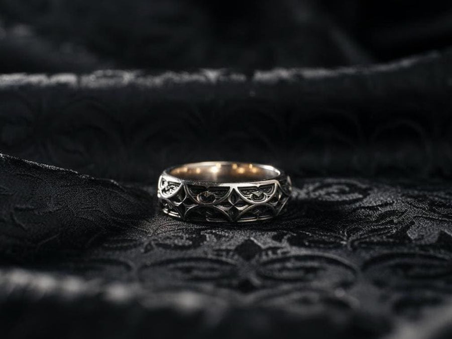 The image demonstrates the seamless nature of the pattern, which wraps around the ring without a visible break. This indicates high-quality casting and mold-making. The rim is substantial but rounded, preventing the ring from digging into the finger. It showcases a balance between rugged "blacksmith" aesthetics and fine jewelry finishing. (etsy image id: 6100248085)