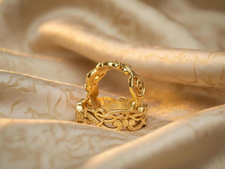 The Celtic set is reimagined in 14k Yellow Gold. The transformation makes the rings look like ancient gold coins or torcs discovered in a hoard. The warm metal makes the Triskelion symbol pop, giving it a solar (sun) connotation rather than a lunar one. This version feels regal and warm, perfect for a summer solstice wedding or a golden anniversary gift.