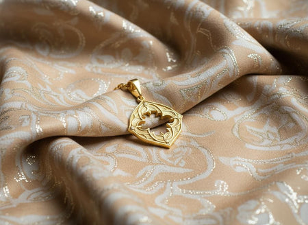 The openwork pendant is reimagined in 14k Yellow Gold. The transformation gives it the look of a golden window frame from a royal chapel. The warm metal framing the empty space creates a "sunburst" effect. This version feels lighter and more celestial than the silver, perfect for a wearer who prefers the warmth of the sun over the shadows of the moon. (etsy image id: 7448420136)