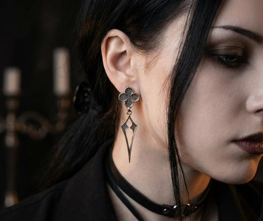 With their timeless beauty and one-of-a-kind design, these earrings are a must-have accessory for anyone who wants to stand out from the crowd. Don't miss this opportunity to own a piece of gothic elegance, order now! The image highlights the contrast between the two sections. The stud features a dense, "micro-relief" pattern that looks like chainmail or textile. The drop is smooth and linear, providing a visual break. (etsy image id: 7090850125)