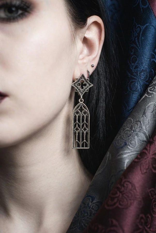 The image focuses on the interplay of light and shadow on the 925 sterling silver. The ridges of the arches are polished to a high shine, while the inner recesses are blackened with oxidation. This technique gives the earrings the visual weight of stone masonry while maintaining the lightness required for a comfortable ear dangle. (etsy image id: 7218591328)