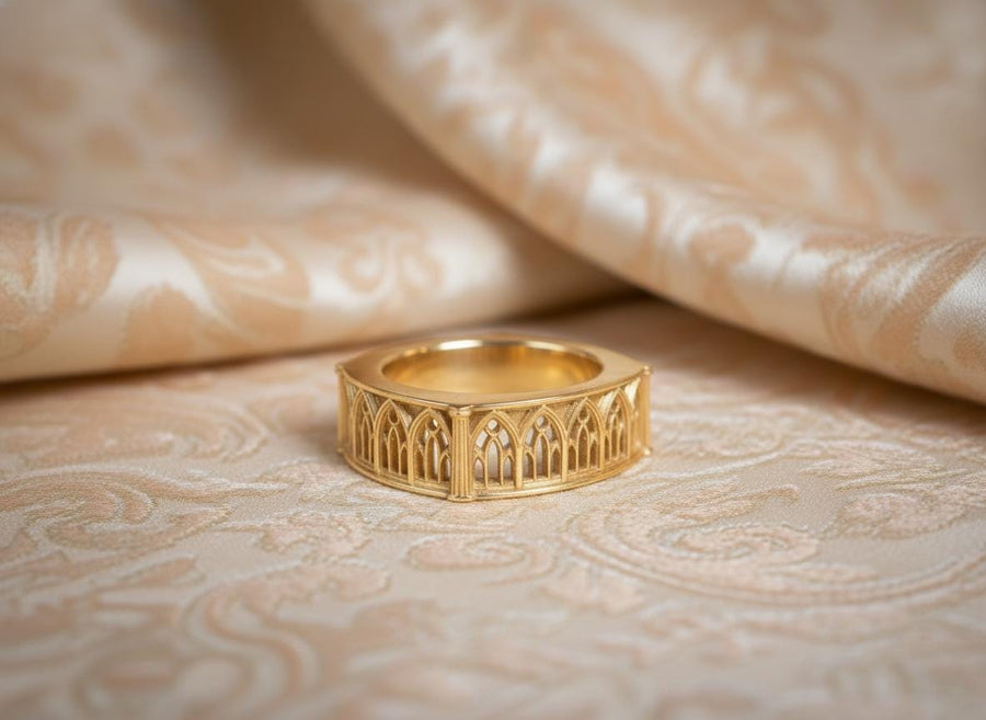 Defend your realm with this architectural fortress ring. Distinctive for its soft-square outer profile, this sterling silver band features a continuous cloister of Gothic arches anchored by robust corner buttresses. The geometric design mimics the stone ramparts of a medieval castle. Heavily oxidized to reveal the depth of the masonry, it is a symbol of unshakeable strength and structure. A bold statement for the guardian of history. (etsy image id: 7450412634)