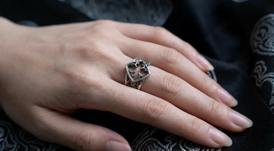 Detailed view of the ring's texture, showing the stippled, hammered finish inside the recessed arches. This "granulation" effect adds a raw, artisan quality to the piece, distinguishing it from mass-produced jewelry. The 925 sterling silver has been treated with sulfur to achieve a permanent dark patina in the low points, ensuring the architectural pattern remains visible even with daily wear. The metal looks solid and durable, suit (etsy image id: 6980758746)