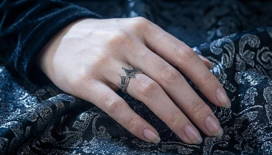 statement ring,	silver ring,	rare ring, gothic architecture,	goth ornament,	gothic window, The image highlights the depth of the casting. The 925 sterling silver features two distinct textures: the smooth, reflective structural lines and the gritty, matte "chainmail" texture within the arches. The oxidation gives the ring an antique patina, making it look like a forged artifact rather than a stamped piece of metal. (etsy image id: 7028750895)