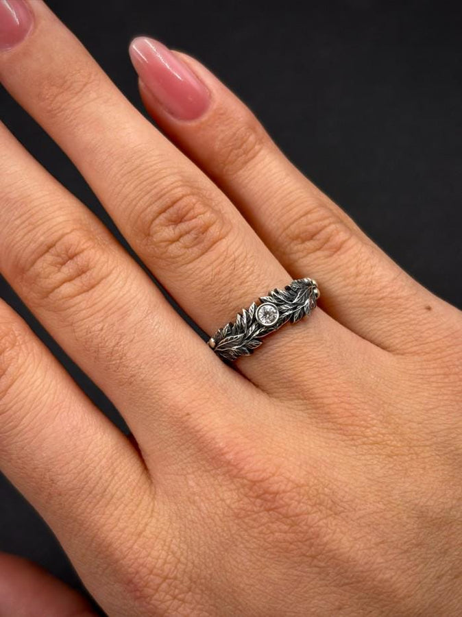 Crafted with care, this gothic silver ring with its vintage charm and gemstone centerpiece will add a touch of dark elegance to any occasion, making it a perfect gift. (etsy image id: 7463722171)
