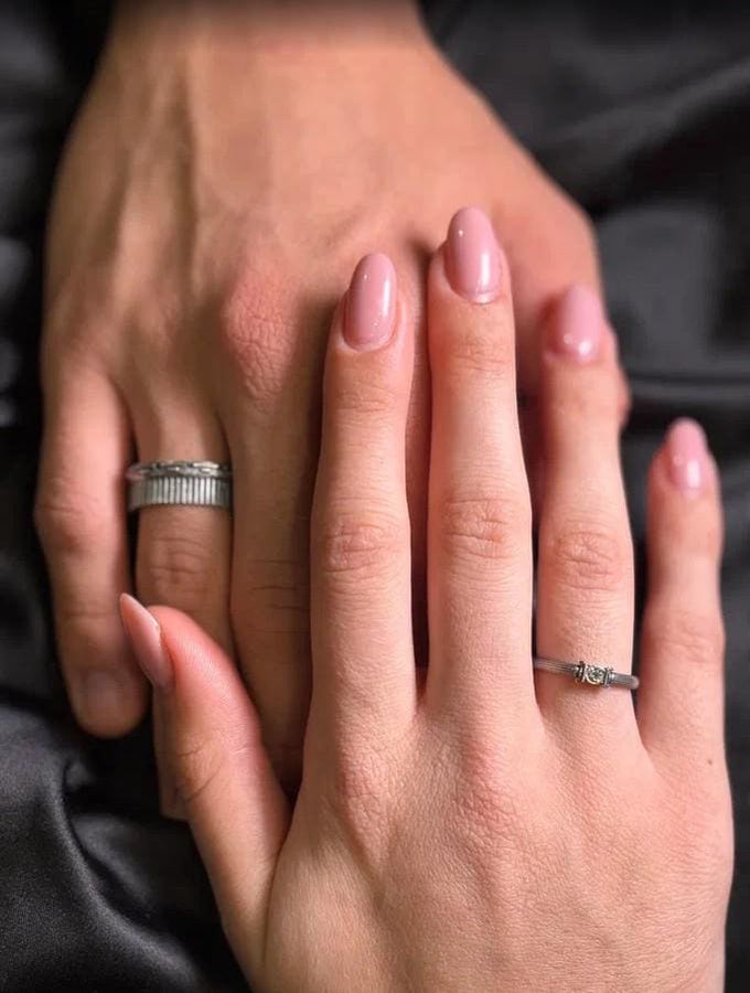 The photograph captures a slim Victorian silver ring with a gemstone framed by sculpted column motifs. Fine linear textures cover the band, giving it a classical, antique appeal. The gemstone sparkles softly, contrasting the darker oxidized grooves. This intricate design suits those who appreciate architectural jewelry, artistic detailing, and meaningful handmade engagement pieces. (etsy image id: 6976743880)