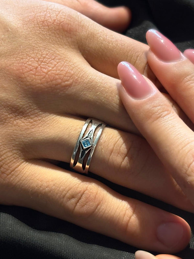 Mysterious and enchanting, this gothic silver ring is handcrafted with delicate detailing and a gemstone that adds a striking contrast to its intricate design.
A dramatic sterling silver ring with a central square blue gem, surrounded by carved details reminiscent of gothic architecture. Ideal for wearers seeking distinctive jewelry that stands apart from classic designs. (etsy image id: 7283442213)