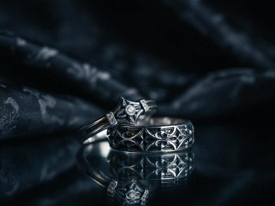 Bathed in soft, romantic light against elegant white silk, this alternative bridal set perfectly balances dark gothic architecture with traditional wedding luxury. The rings evoke a mysterious, dark academia atmosphere, capturing the timeless beauty of ancient stone cathedrals and eternal devotion. Designed for modern couples who appreciate history and non-traditional aesthetics, this matching wedding set is a profound symbol of a love story root (etsy image id: 7928015292)