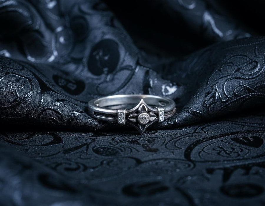A macro photograph of a sterling silver ring with a distinct medieval silhouette. The centerpiece is a four-pointed "cross" or "star" shape holding a round, amber-hued gemstone (Citrine). The band is flanked by small, vertical bars set with tiny accent stones that sparkle in the light. The metal features a mix of high-polish highlights and dark, oxidized recesses, giving it an antique, artifact-like appearance. (etsy image id: 7488715953)