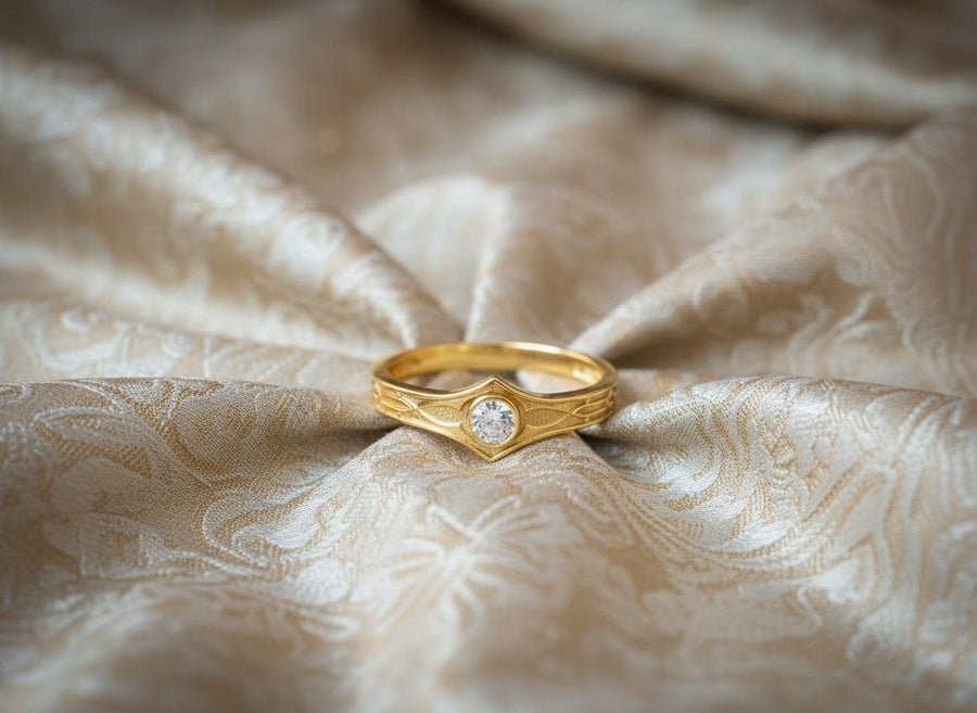 A cinematic close-up of a sterling silver ring with a distinct "V" shaped or "Lance Tip" contour. The focal point is a bezel-set, round gemstone with a deep amber-orange hue (Citrine or Madeira Citrine). The shoulders of the band feature horizontal grooves that taper toward the center, resembling the shaft of a spear or the fletching of an arrow. The metal is polished but features dark oxidation in the grooves for contrast. (etsy image id: 7489049399)