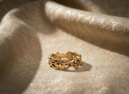 The openwork band is reimagined in 14k Yellow Gold. The transformation makes the ring look like fine gold filigree or wirework from an ancient museum collection. The warm metal glows against the skin, making the "infinity" loops stand out even more. This version feels delicate, regal, and precious, perfect for a vintage-style bride. (etsy image id: 7490348251)