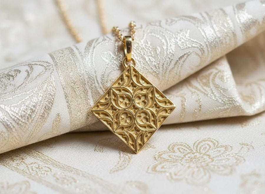 A detailed studio shot of a diamond-shaped (lozenge) sterling silver pendant hanging vertically. The design features intricate "curvilinear" Gothic tracery—four teardrop shapes meeting in the center to form a cross or quatrefoil. The raised lines are polished bright silver, while the negative space behind them is heavily oxidized to a matte black, creating a high-contrast architectural look. (etsy image id: 7494090955)