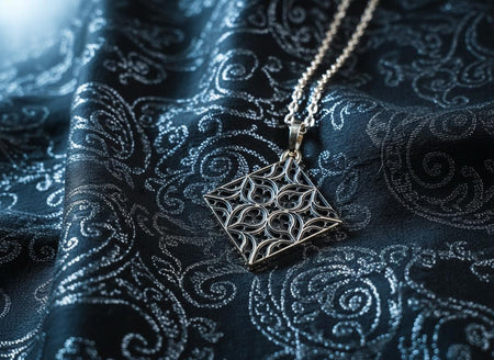 A detailed studio shot of a diamond-shaped (lozenge) sterling silver pendant hanging vertically. The design features intricate "curvilinear" Gothic tracery—four teardrop shapes meeting in the center to form a cross or quatrefoil. The raised lines are polished bright silver, while the negative space behind them is heavily oxidized to a matte black, creating a high-contrast architectural look. (etsy image id: 7494090955)