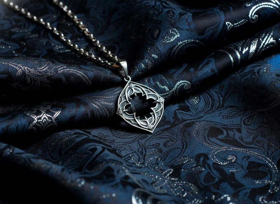 Sterling Silver Gothic Pendant, Holiday Gift, Handmade Medieval Pendant, Goth Necklace, Gothic Jewelry, A cinematic studio shot of a diamond-shaped sterling silver pendant hanging against a smoky, amber-lit background. The design is "openwork," featuring a central cutout in the shape of a four-lobed quatrefoil with sharp, barbed cusps. The silver frame mimics the stone mullions of a Gothic window. The metal is polished on the ridges and (etsy image id: 6258009905)