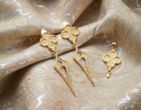 The design is reimagined in 14k White Gold. The transformation makes them look like "Paladin" gear or futuristic armor. The white gold offers a cooler, steel-like tone that looks sharper than silver. The lattice texture in the stud sparkles like pavé diamonds without the need for stones. This version feels sleek, futuristic, and high-fashion. (etsy image id: 7497021663)