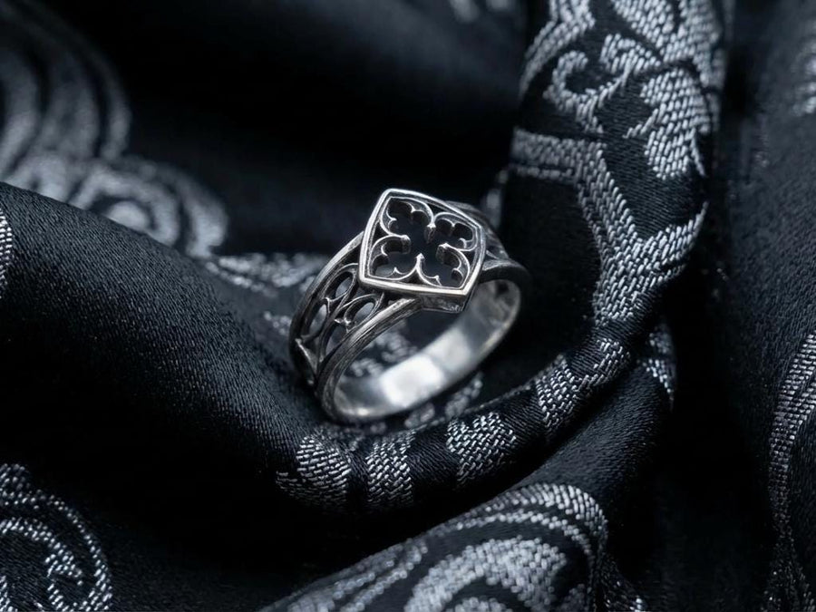 Detailed view of the ring's texture, showing the stippled, hammered finish inside the recessed arches. This "granulation" effect adds a raw, artisan quality to the piece, distinguishing it from mass-produced jewelry. The 925 sterling silver has been treated with sulfur to achieve a permanent dark patina in the low points, ensuring the architectural pattern remains visible even with daily wear. The metal looks solid and durable, suit (etsy image id: 6980758746)