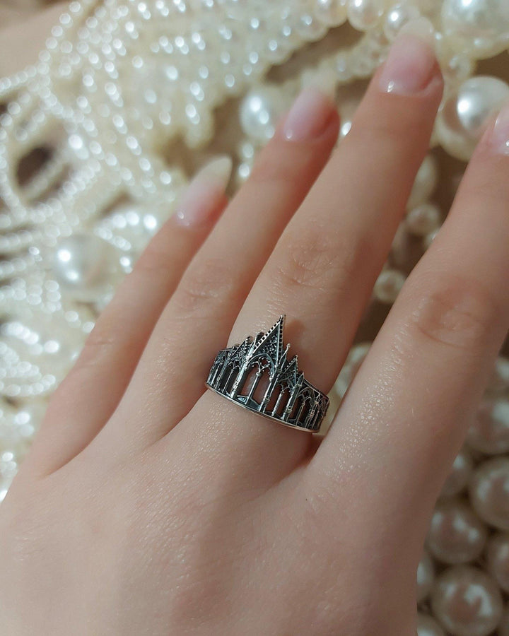 We have rings for people who love to explore the great outdoors, as well as those who love to stay in. With memories and kindness. The image highlights the "chiselled" quality of the 925 sterling silver. The ridges of the rooflines and pillars are sharp and defined, while the background surfaces have a textured, grainy finish like limestone. The oxidation is applied carefully to the "windows" and "doors" of the cathe (etsy image id: 4211827296)