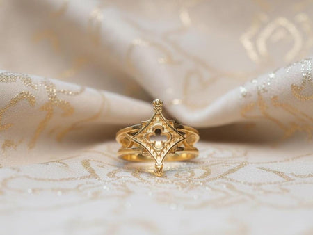 The Compass ring is reimagined in 18k Yellow Gold. The transformation turns the "Silver Guide" into a "Royal Star." The warm metal makes the quatrefoil tracery look like a golden window in a palace. This version feels luxurious and solar, perfect for a wearer who wants a piece of "everyday armor" that still feels opulent and precious. (etsy image id: 7500164775)
