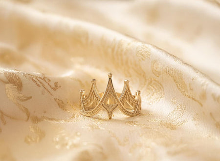 The Crown ring is reimagined in 14k White Gold. The transformation creates an "Ice Queen" aesthetic. The cool white metal enhances the sharp geometry, making the ring look like it was carved from a glacier or diamond. The textured recesses sparkle subtly. This version feels sleek, modern, and high-fashion, perfect for a winter wedding. (etsy image id: 7500258949)