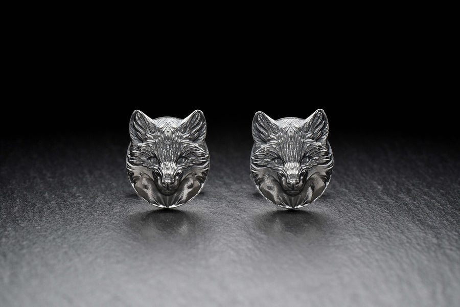 May include: A pair of silver fox head cufflinks. The cufflinks are round and feature a detailed fox head design. (etsy image id: 7689621560)