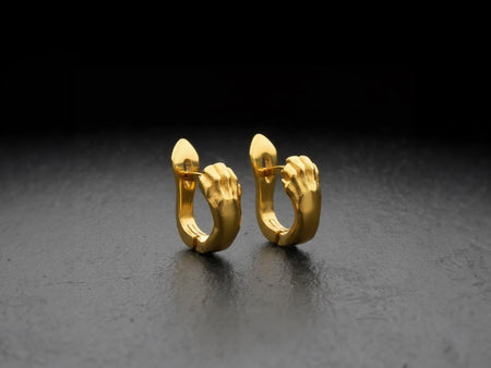 Reimagined in solid 14k yellow gold, these realistic cat paw huggie earrings transform from a dark gothic accessory into a radiant, opulent treasure. The warm golden metal softens the realistic claws, highlighting the intricate paw pads and knuckles with a luxurious, regal glow. The deep recesses feature a soft matte finish rather than black oxidation, creating a striking contrast. This magnificent fine jewelry version elevates the animal motif i (etsy image id: 7855959882)