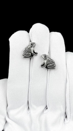 These silver frog stud earrings bring playful charm and character to your jewelry collection while still feeling refined enough for everyday wear. With their sculpted frog shape and detailed texture, they create a whimsical, nature-inspired look that feels expressive, memorable, and easy to style. (etsy image id: 7915743358)