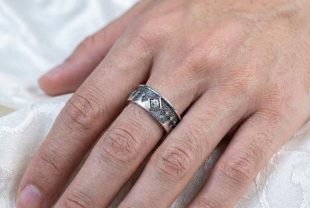 Bathed in soft, romantic light against elegant white silk, this alternative bridal set perfectly balances dark gothic architecture with traditional wedding luxury. The rings evoke a mysterious, dark academia atmosphere, capturing the timeless beauty of ancient stone cathedrals and eternal devotion. Designed for modern couples who appreciate history and non-traditional aesthetics, this matching wedding set is a profound symbol of a love story root (etsy image id: 7928015292)
