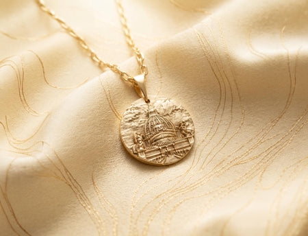 Reimagined in solid 14k yellow gold, this Castle of the Holy Angel pendant transforms from a brooding stone fortress into a radiant, sunlit imperial palace. The warm golden metal highlights the intricate dome and colonnades, giving the architectural relief an opulent, regal glow reminiscent of precious Vatican treasures. The deep recesses feature a soft matte finish rather than black oxidation, creating a luxurious contrast that elevates this his (etsy image id: 7960060651)