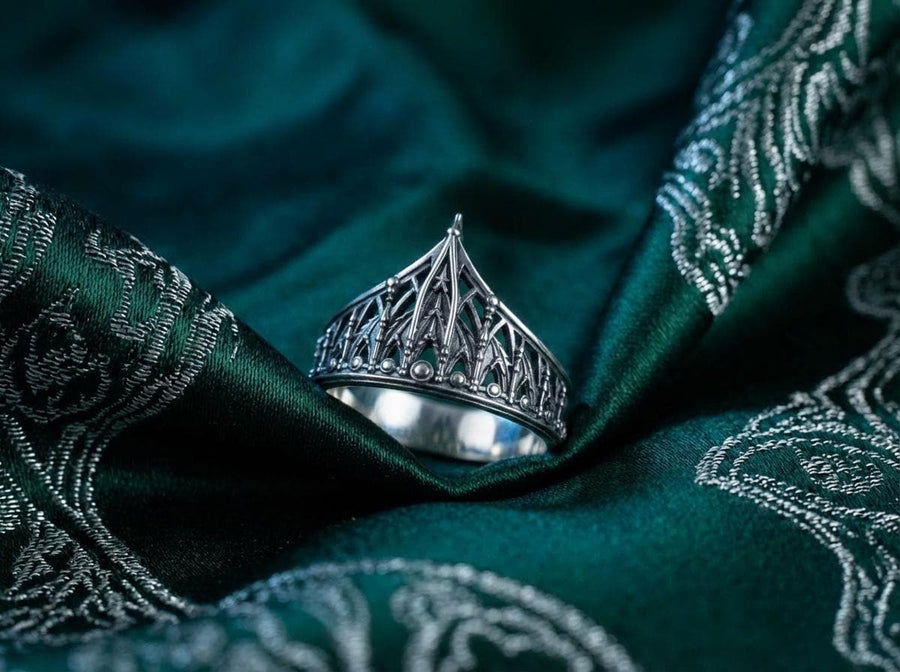 The spire represents the connection between the earth and the heavens, or high aspirations. The ribbed vaulting represents strength through structure. Wearing this ring as a "crown" on the finger symbolizes personal sovereignty and a dedication to higher ideals. It is a piece that commands respect. (etsy image id: 7976017075)