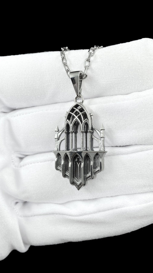 This macro image highlights the masterful craftsmanship of the solid 925 sterling silver casting. The artisan has flawlessly translated monumental stone architecture into miniature metalwork. The columns are smooth and precise, while deep sulfur oxidation creates a permanent matte black shadow in the open recesses of the arches. This traditional antiquing technique gives the gothic relic pendant the weathered, enduring texture of an actual historical cathedral fragment. (etsy image id: 7979026828)