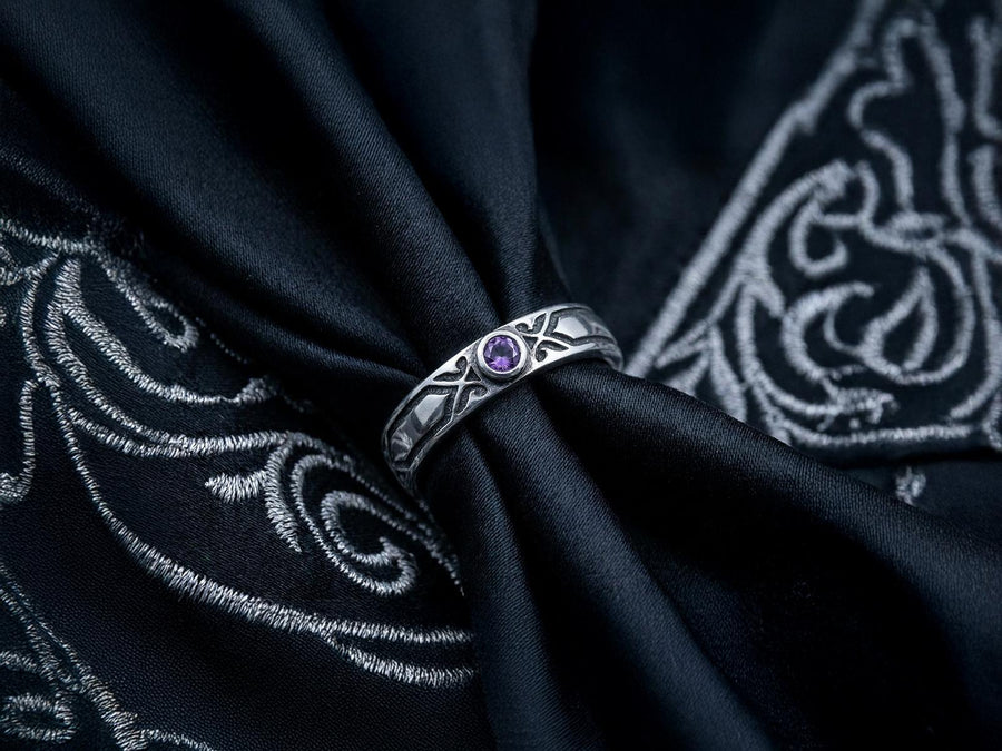 A professional studio photograph of a matching two-piece sterling silver wedding ring set. Both rings feature a prominent, raised Greek-style cross motif in the center, which holds a round, bezel-set white crystal. The interior of the cross arms has a fine, cross-hatched grid texture. Along the sides of the high-polished silver bands are recessed, four-lobed quatrefoil shapes. The rings are presented against a pitch-black background, making the p __etsy:8051335185