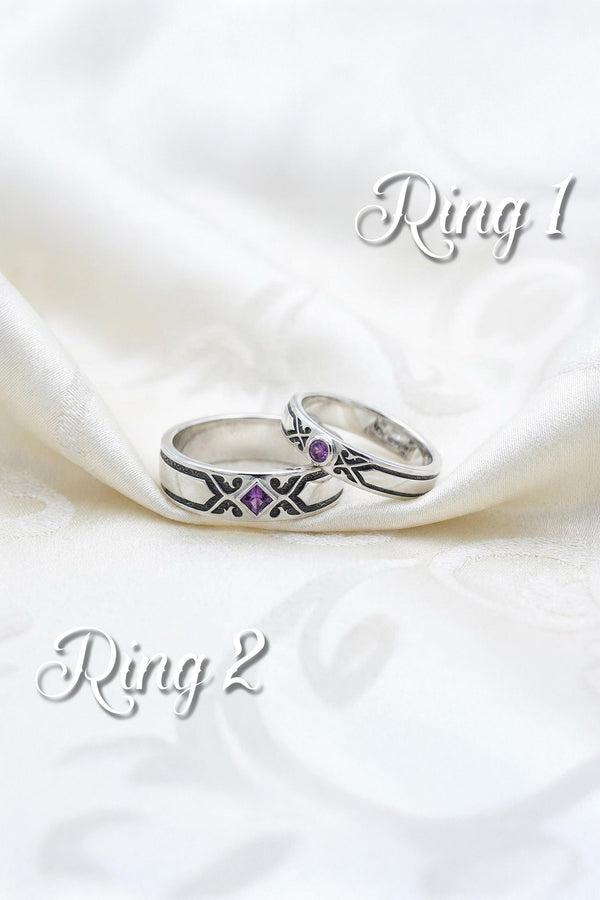 A professional studio photograph of a matching two-piece sterling silver wedding ring set. Both rings feature a prominent, raised Greek-style cross motif in the center, which holds a round, bezel-set white crystal. The interior of the cross arms has a fine, cross-hatched grid texture. Along the sides of the high-polished silver bands are recessed, four-lobed quatrefoil shapes. The rings are presented against a pitch-black background, making the p __etsy:8051335185