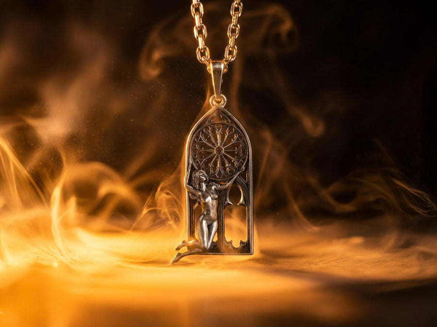 A cinematic studio shot of a tall, arched sterling silver pendant. The frame mimics a Gothic cathedral window. Inside the arch, a sculpted female figure (appearing nude) kneels or floats, reaching up to hold a large, circular "Rose Window" tracery wheel above her head. The silver is heavily oxidized, creating deep shadows behind the figure and the window spokes. (etsy image id: 7448666740)