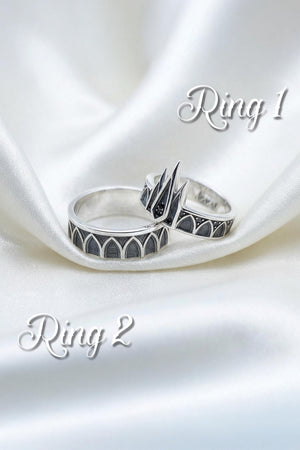 Modeled as a highly versatile alternative bridal set, these stunning gothic silver rings offer a bold yet elegant statement for non-traditional couples. The tiara ring adds a touch of classic vamp romantic styling, while the matching band provides a sturdy architectural presence. They pair flawlessly with vintage lace, dark velvet attire, or minimalist black wardrobes for a beautifully dark romantic wedding.