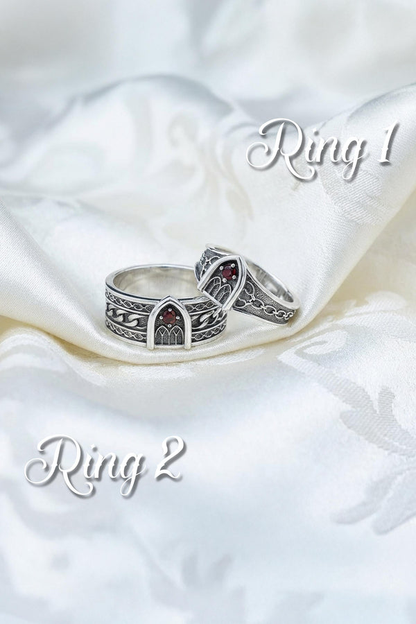 A professional studio photograph of a matching two-piece sterling silver wedding ring set. Both rings feature a prominent, raised Greek-style cross motif in the center, which holds a round, bezel-set white crystal. The interior of the cross arms has a fine, cross-hatched grid texture. Along the sides of the high-polished silver bands are recessed, four-lobed quatrefoil shapes. The rings are presented against a pitch-black background, making the p __etsy:8051335185