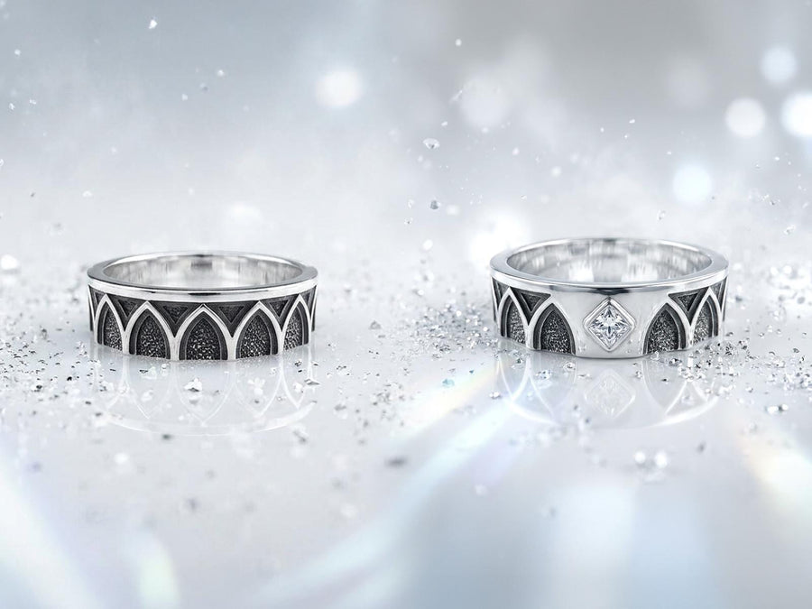 A professional studio photograph of a matching two-piece sterling silver wedding ring set. Both rings feature a prominent, raised Greek-style cross motif in the center, which holds a round, bezel-set white crystal. The interior of the cross arms has a fine, cross-hatched grid texture. Along the sides of the high-polished silver bands are recessed, four-lobed quatrefoil shapes. The rings are presented against a pitch-black background, making the p __etsy:8051335185