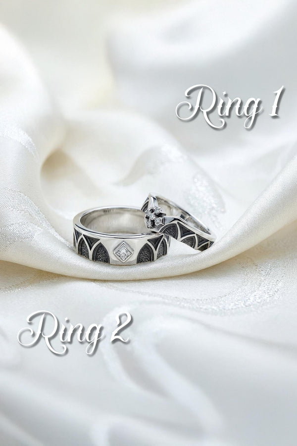 A professional studio photograph of a matching two-piece sterling silver wedding ring set. Both rings feature a prominent, raised Greek-style cross motif in the center, which holds a round, bezel-set white crystal. The interior of the cross arms has a fine, cross-hatched grid texture. Along the sides of the high-polished silver bands are recessed, four-lobed quatrefoil shapes. The rings are presented against a pitch-black background, making the p __etsy:8051335185
