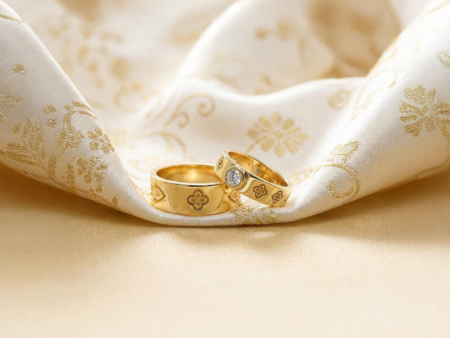 This dark academic ring set captures the mysterious romance of a medieval cathedral. Bright studio lighting highlights the polished silver rims, contrasting dramatically with the pitch-black sulfur oxidation in the carved quatrefoil recesses. Rich in gothic symbolism, the continuous quatrefoil motif represents the intersection of earth and heaven, mirroring the windows of ancient cathedrals. It serves as a profound talisman of eternal devotion an